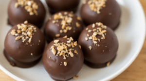 Vegan Butterfinger Balls with dark chocolate coating and peanut butter filling