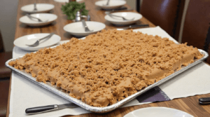 Texas Sheet Cake at a party, ready to be served.